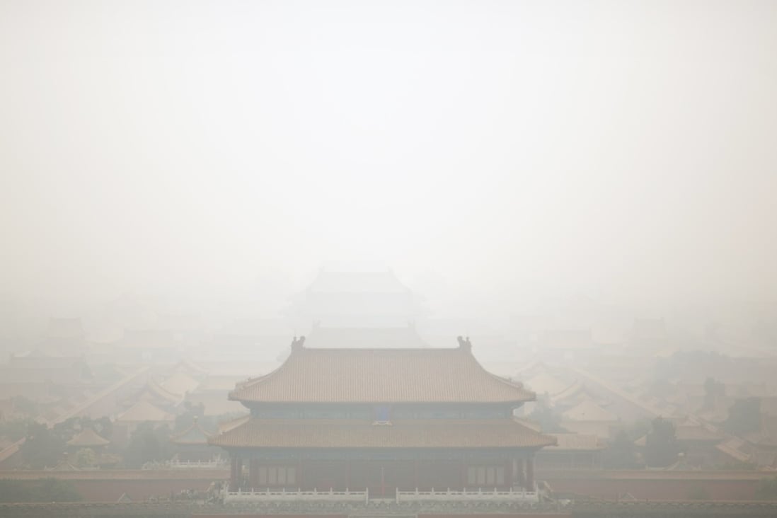 Haze surrounds the Forbidden City on a polluted day in Beijing during last months’ National Day holiday as the country gets ready to finalise the rules for green bonds in the next few weeks. Photo: AP
