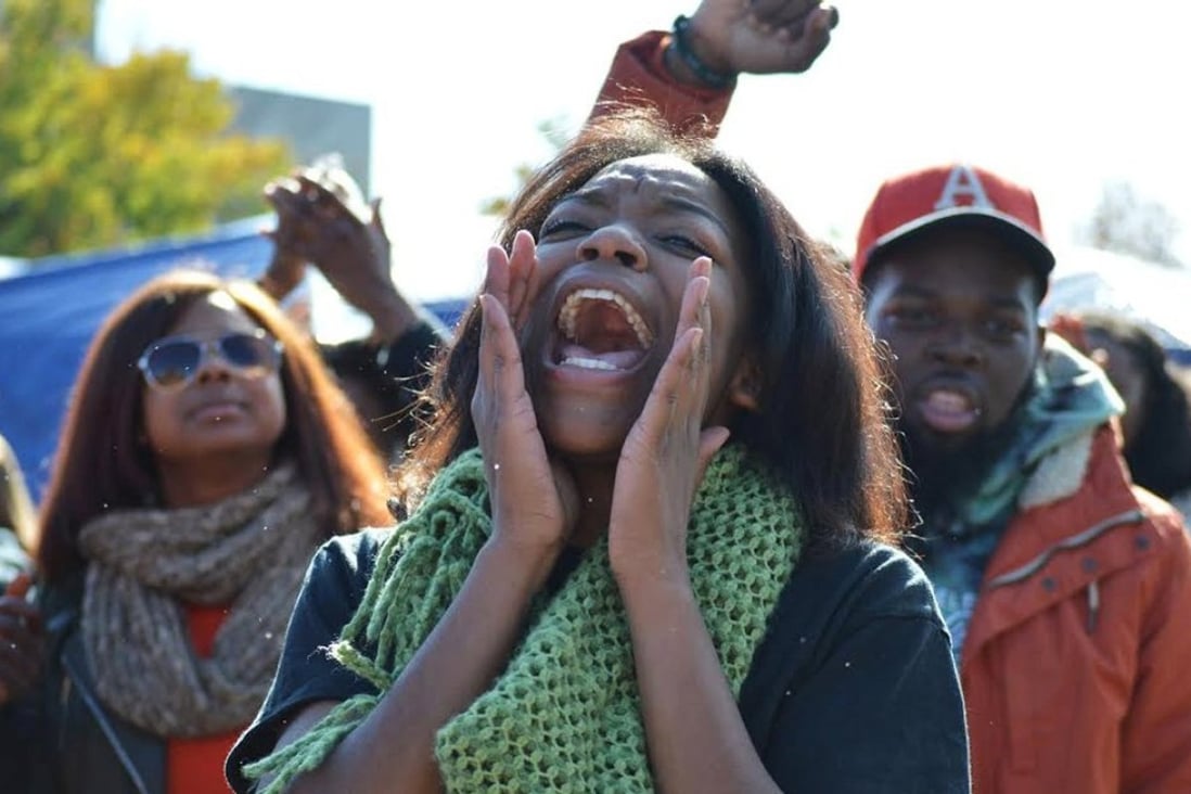 A student chants after the University of Missouri's president Tim Wolfe announced his resignation on Monday. Photo: Reuters