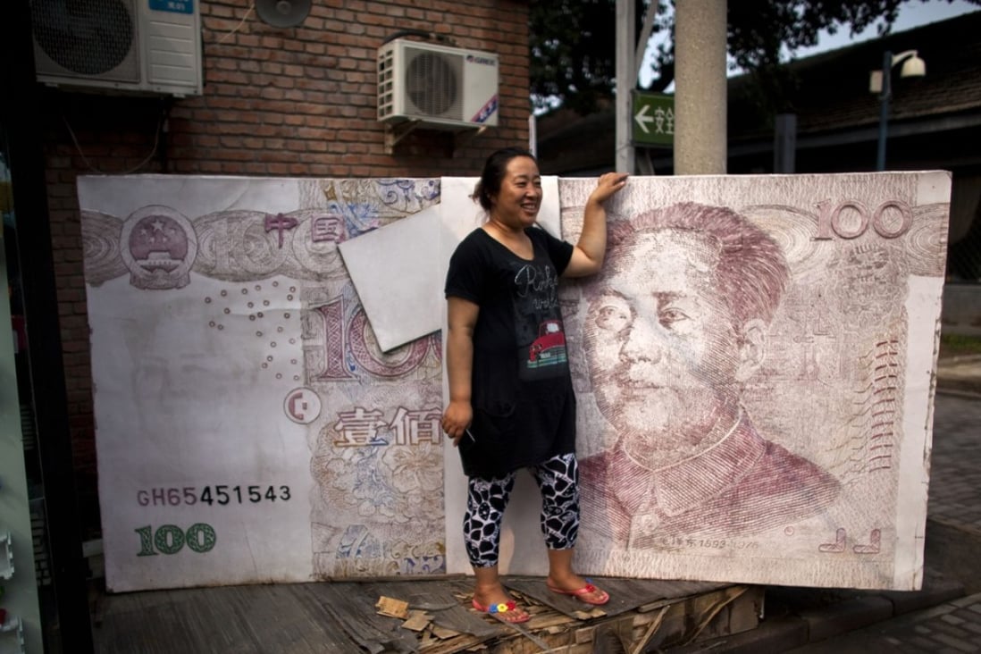 The yuan has come under pressure as China has cut interest rates while the United States is preparing to raise them. Photo: AP