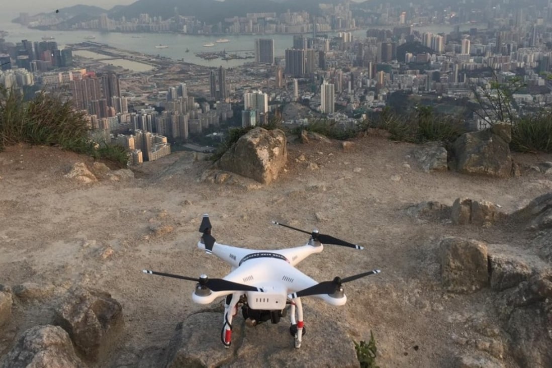 A Phantom 2 drone by Shenzhen-based DJI readies for take off over Kowloon near Hong Kong Island. The new regulations will apply in mainland China but not in Hong Kong. Photo: Edwin Lee