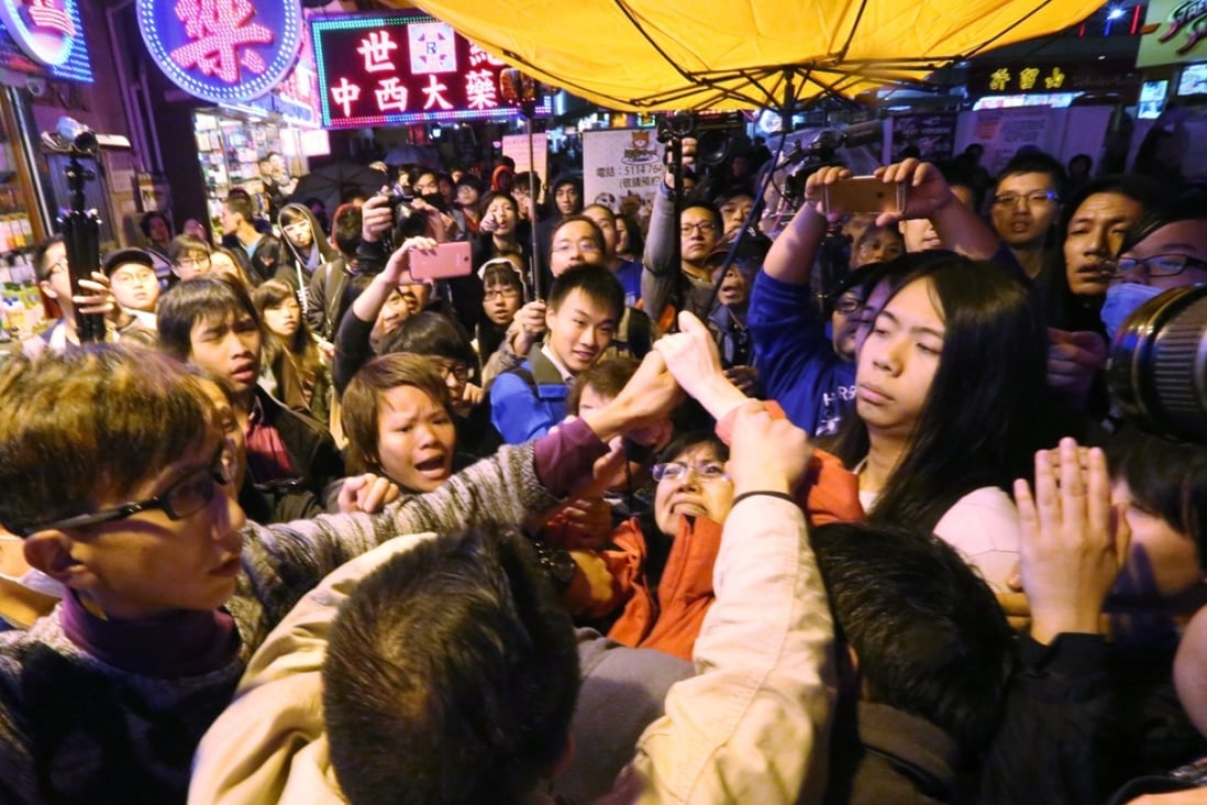 Activists clash over the weekend at a gathering held in Mong Kok to oppose the copyright bill. Photo: Edward Wong