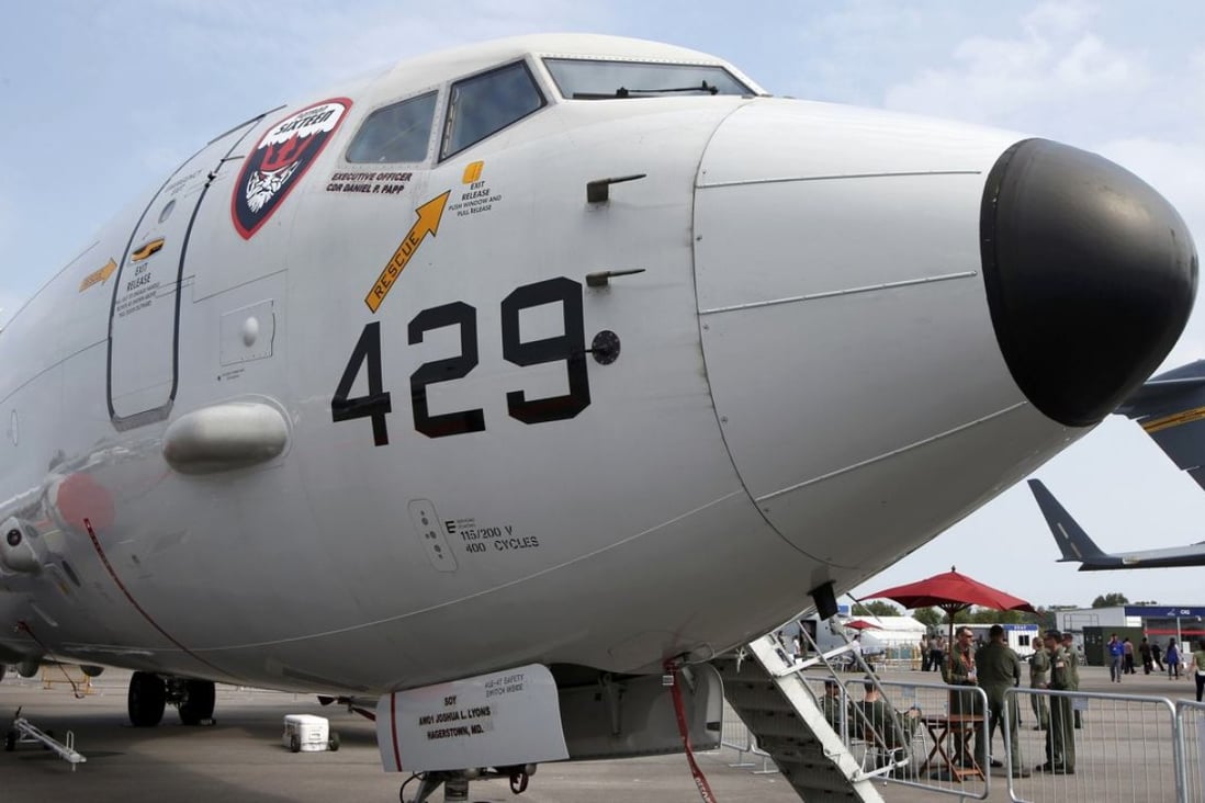 A US Navy Boeing Poseidon P8 aircraft sits on display at the 2014 Singapore Airshow . Photo: Reuters