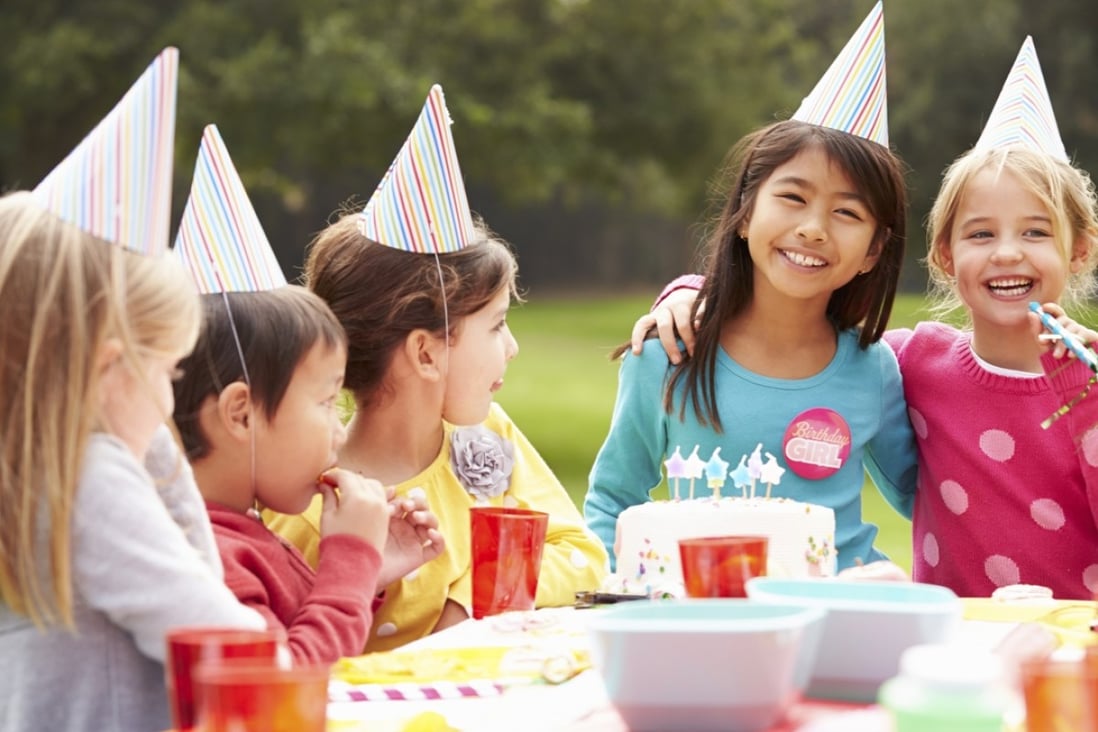 Children enjoy an outdoor birthday party. Photo: Corbis