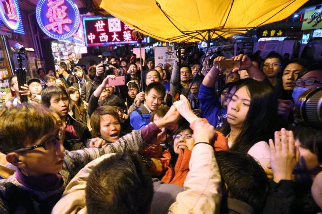 Activists clash over the bill in Mong Kok. Photo: Edward Wong