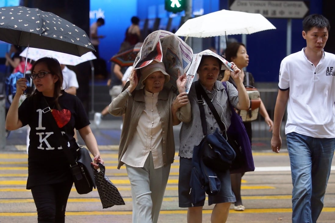 The rain caught some shoppers by surprise. Photo: SCMP Pictures