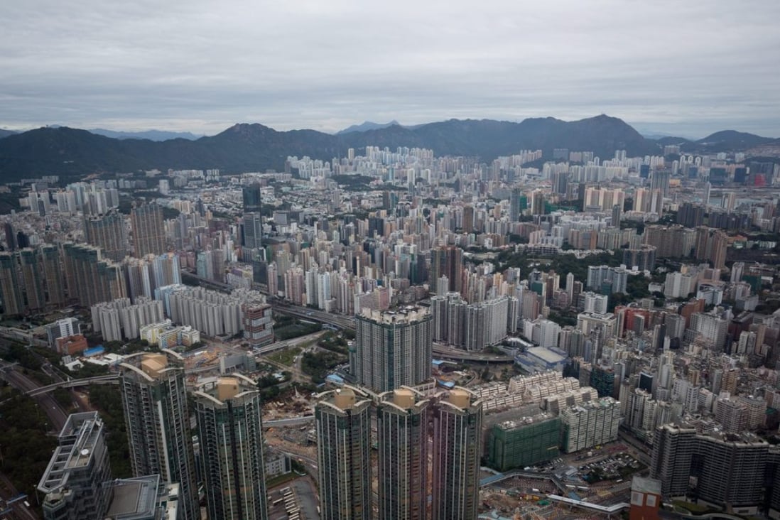 A picture taken through a glass shows a panoramic view of buildings in the Kowloon Peninsula seen from the International Finance Centre on December 6. Photo: JEROME FAVRE of EPA