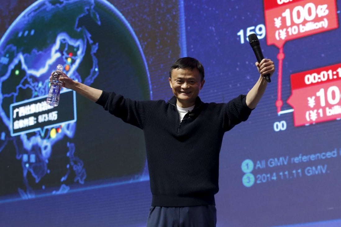Alibaba founder and chairman Jack Ma stands like the master of ceremonies as he celebrates record online shopping transactions during ‘Singles Day’ on November 11 in Beijing. Photo: Reuters