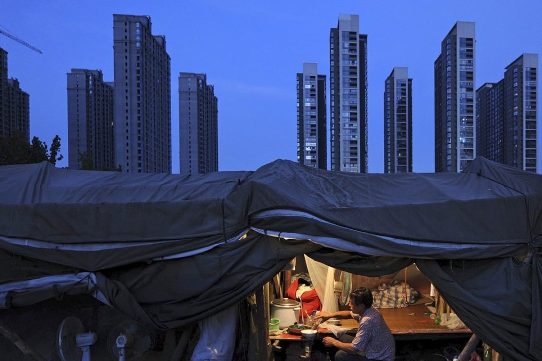 A labourer at a construction site in Hefei, Anhui province. “Downward pressures on the Chinese economy are intensifying continuously,” the Chinese Academy of Social Sciences said on Wednesday. Photo: Reuters