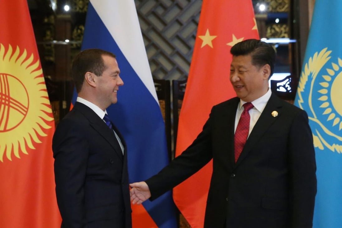 Russian Prime Minister Dmitry Medvedev and Chinese President Xi Jinping in Wuzhen, Zhejiang province, on Wednesday. Photo: EPA