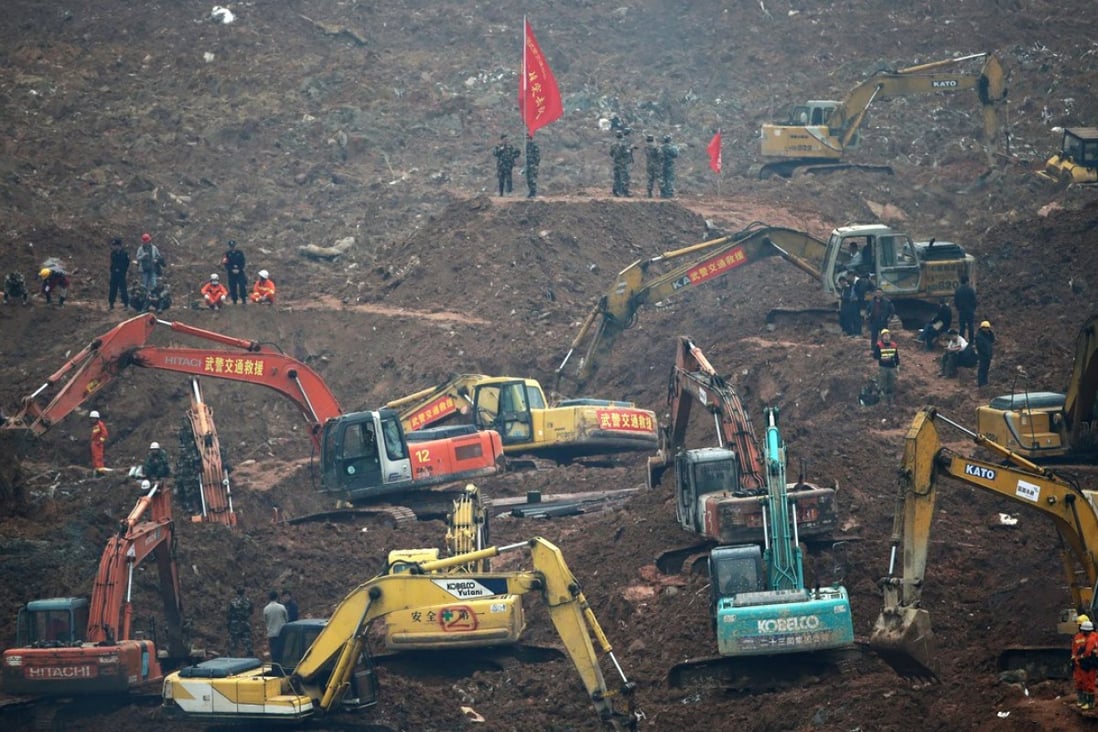 Rescuers use machinery to search for potential survivors at the site of a landslide in Shenzhen. Photo: AP
