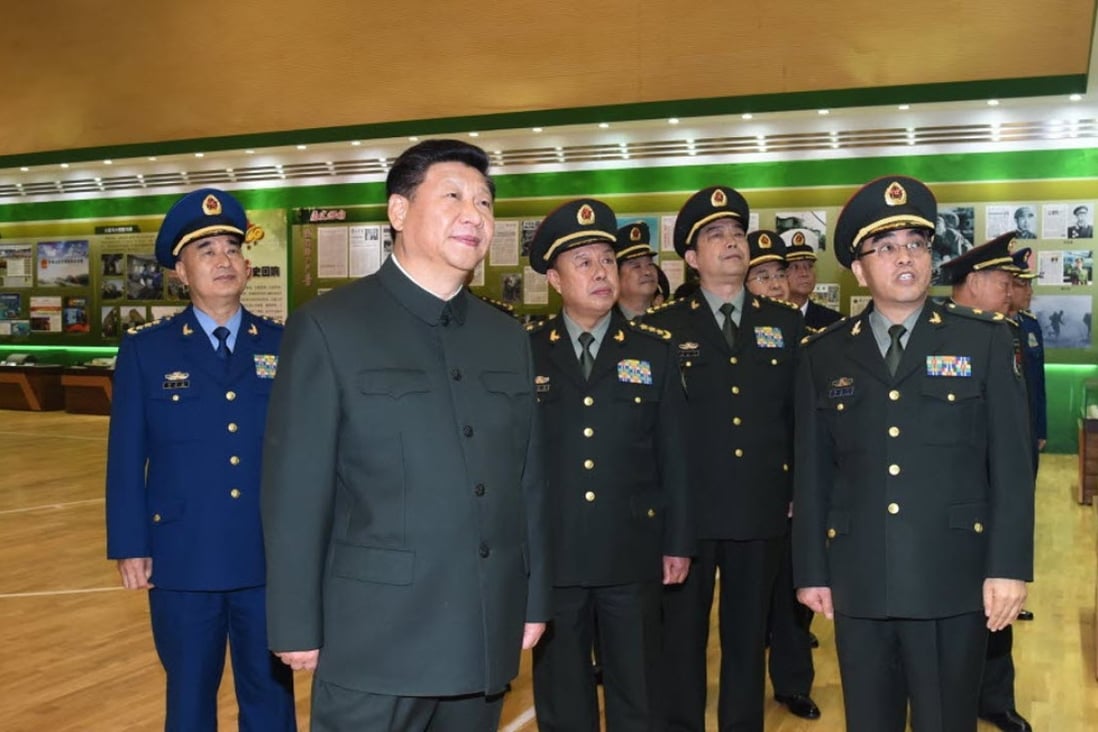 Chinese President Xi Jinping (2nd L) views an exhibition featuring the 60th founding anniversary of the People’s Liberation Army Daily during an inspection of the PLA Daily headquarters in Beijing on Christmas Day. Photo: Xinhua
