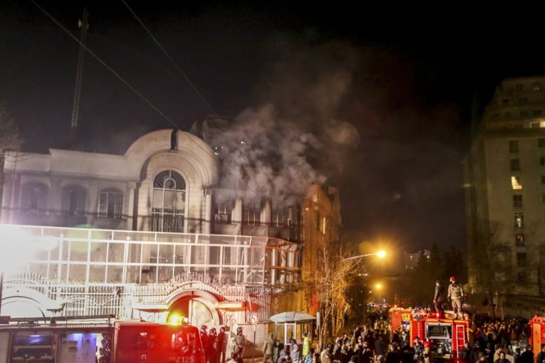 Smoke rises as Iranian protesters, upset over the execution of Shiite cleric Nimr al-Nimr in Saudi Arabia, set fire to the Saudi embassy in Tehran, Iran. Photo: AFP