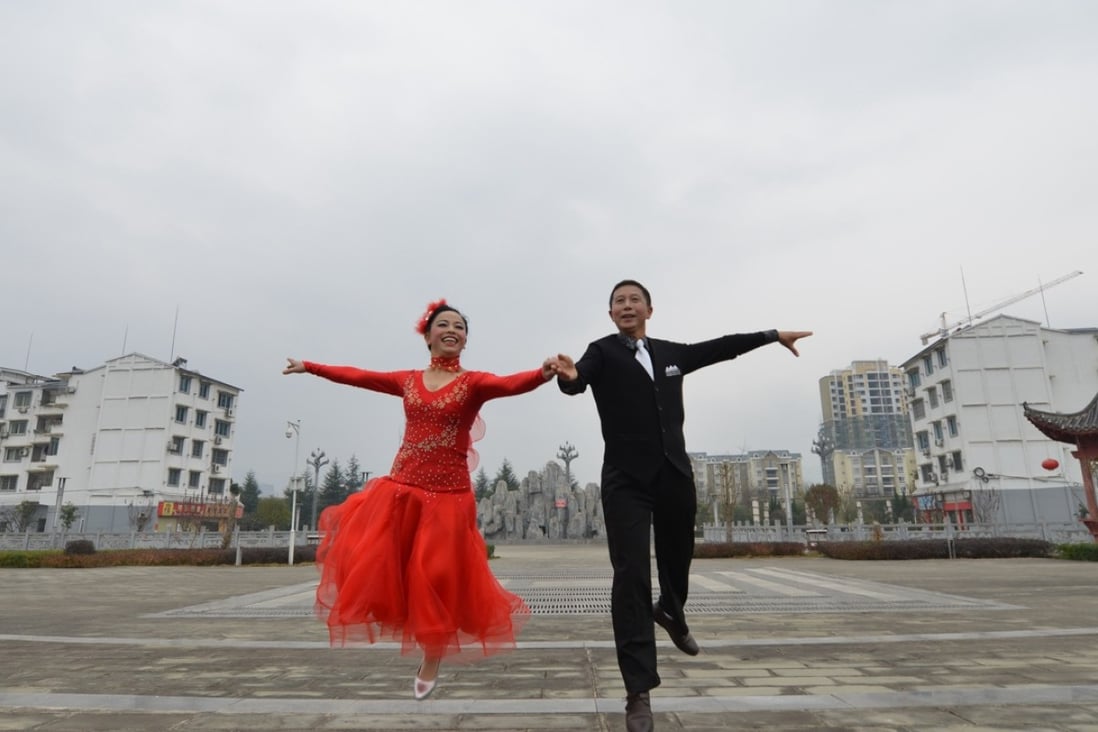 Dancers greet the incoming new year in Zunyi City in southwest China's Guizhou Province. Socam Development is the latest Hong Kong developer to offload assets in China’s third-tier cities, with the sale of a plot in Zunyi to Country Garden. Photo: Xinhua