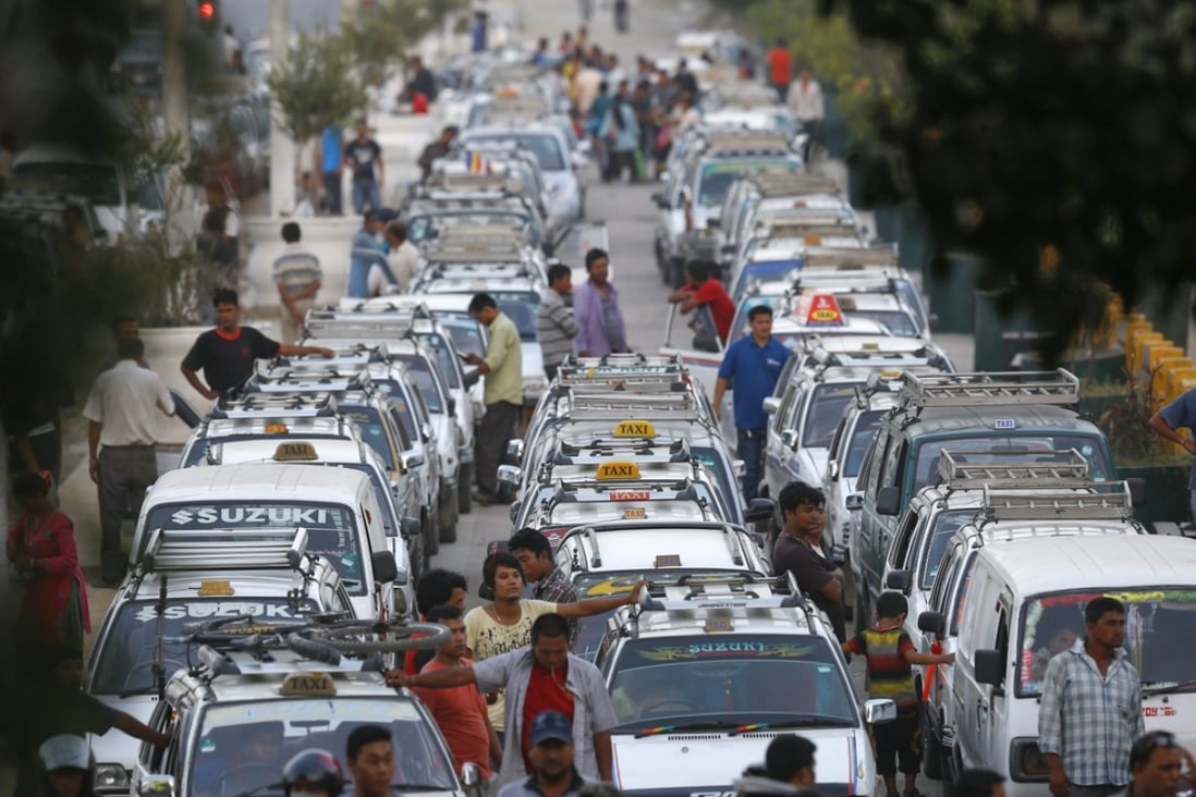 Taxis queue up at a petrol station in Kathmandu, where an unofficial blockade by neighbouring India has triggered a fuel shortage. Photo: EPA