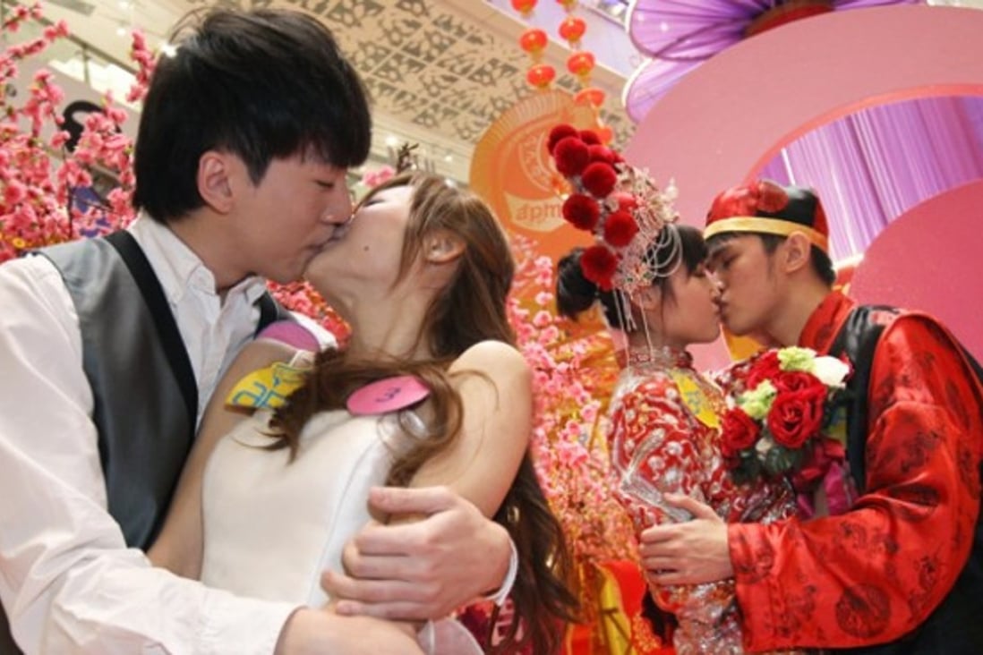 A file picture of couples taking part in a kissing contest last year in Hong Kong. The poll was conducted among 80,000 people around China. Photo: SCMP Pictures