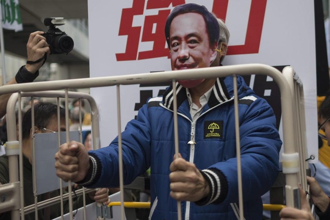 As several thousand protesters marched on the China Liaison Office in Hong Kong their central float held a man representing Lee Bo, a bookseller detained on the mainland since December 30, 2015. Photo: EPA