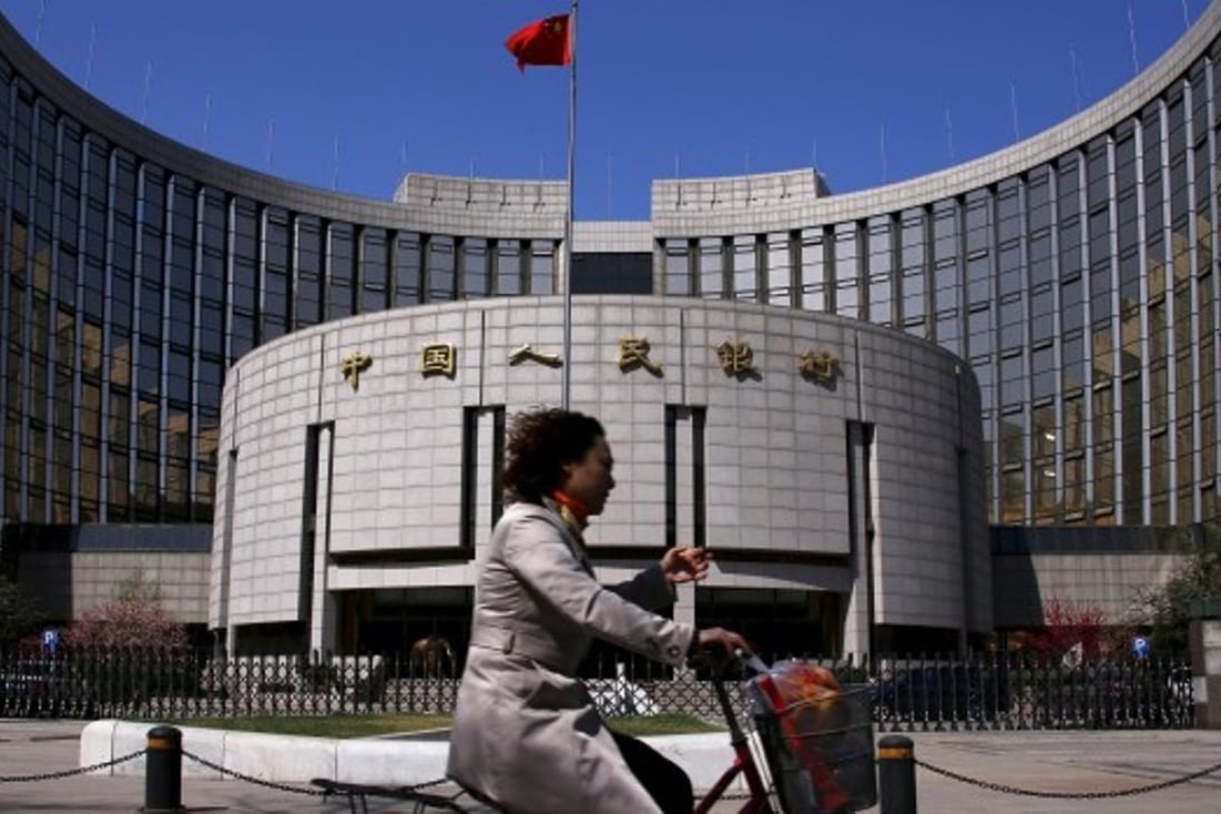 The People’s Bank of China fears cutting the banks’ reserve ratio will cause the yuan to weaken further. Photo: AFP