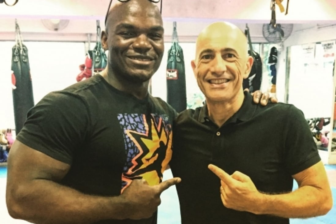 Martial Tribes founder Franck Benhamou (right) with four-time muay Thai world champion Alain Ngalani, the owner of Impakt Gym in Hong Kong and a supporter of the social network.