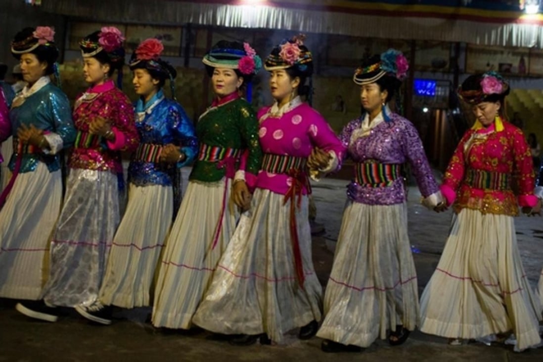 Members of China’s Mosuo ethnic minority, considered one of the last matriarchal societies in the world, dance for tourists in this file photo. Photo: SCMP Pictures