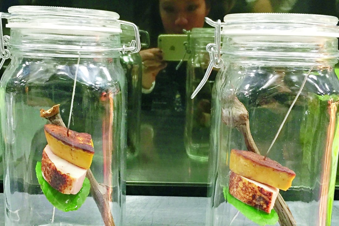 Chicken in a jar served beneath a slice of smoked foie gras at Paul Pairet’s Ultraviolet in Shanghai. Photos: Juliana Loh