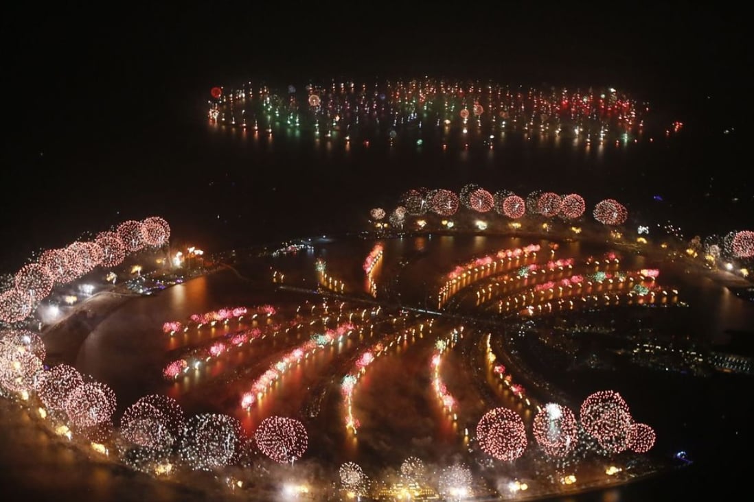Fireworks explode over Palm Jumeirah in Dubai to celebrate the new year. The company that built Palm Jumeirah will double the size of its Dragon Mart complex. Photo: AFP