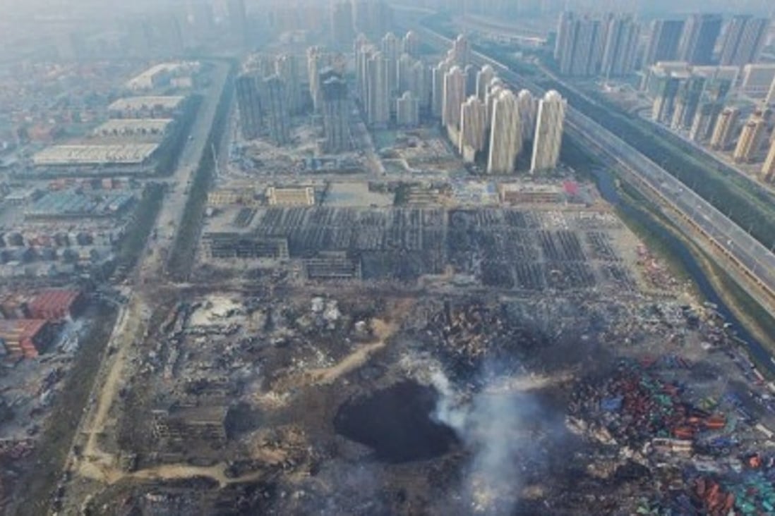 An aerial view of a large crater in the aftermath of a huge explosion that rocked the port city of Tianjin last August. Photo: EPA