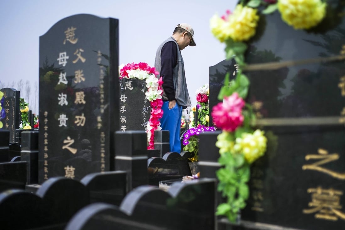 A man prays on the eve of the 2015 Qingming festival, or Tomb Sweeping Day, at a cemetery in Dagantangcun, China. Photo: AFP