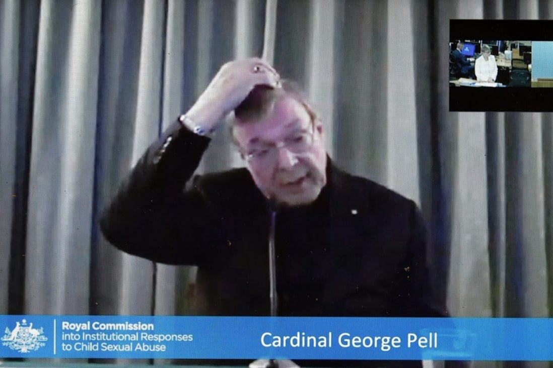 Cardinal George Pell is shown on a video screen in Canberra, Australia, on Monday as he gives evidence to the Royal Comission into Institutional Responses to Child Sexual Abuse via video link from Rome, Italy. Photo: EPA