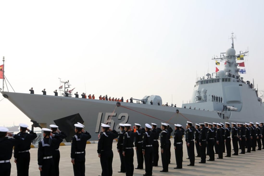 Chinese sailors salute as the destroyer Jinan returns to a military port in Zhoushan, in Zhejiang province in February. President Xi Jinping announced cuts of 300,000 military personnel by 2017. Photo: Xinhua