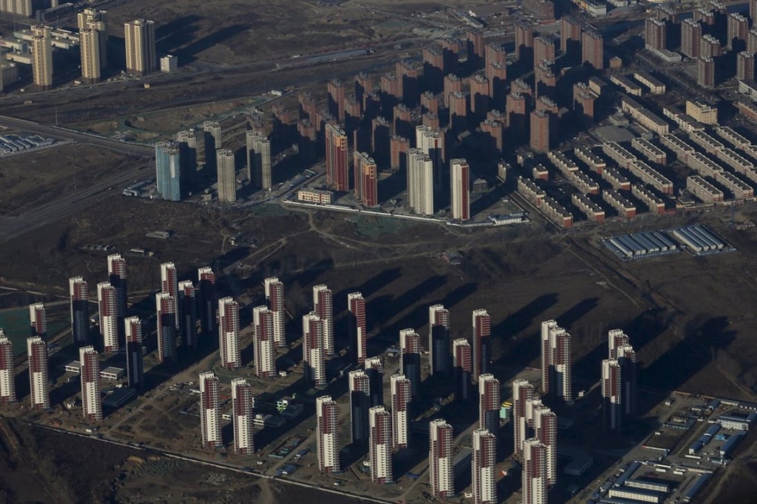 Apartments are seen from a plane on the outskirts of Beijing. Corporates making speculative investments in real estate is not a new phenomenon. Photo: Reuters