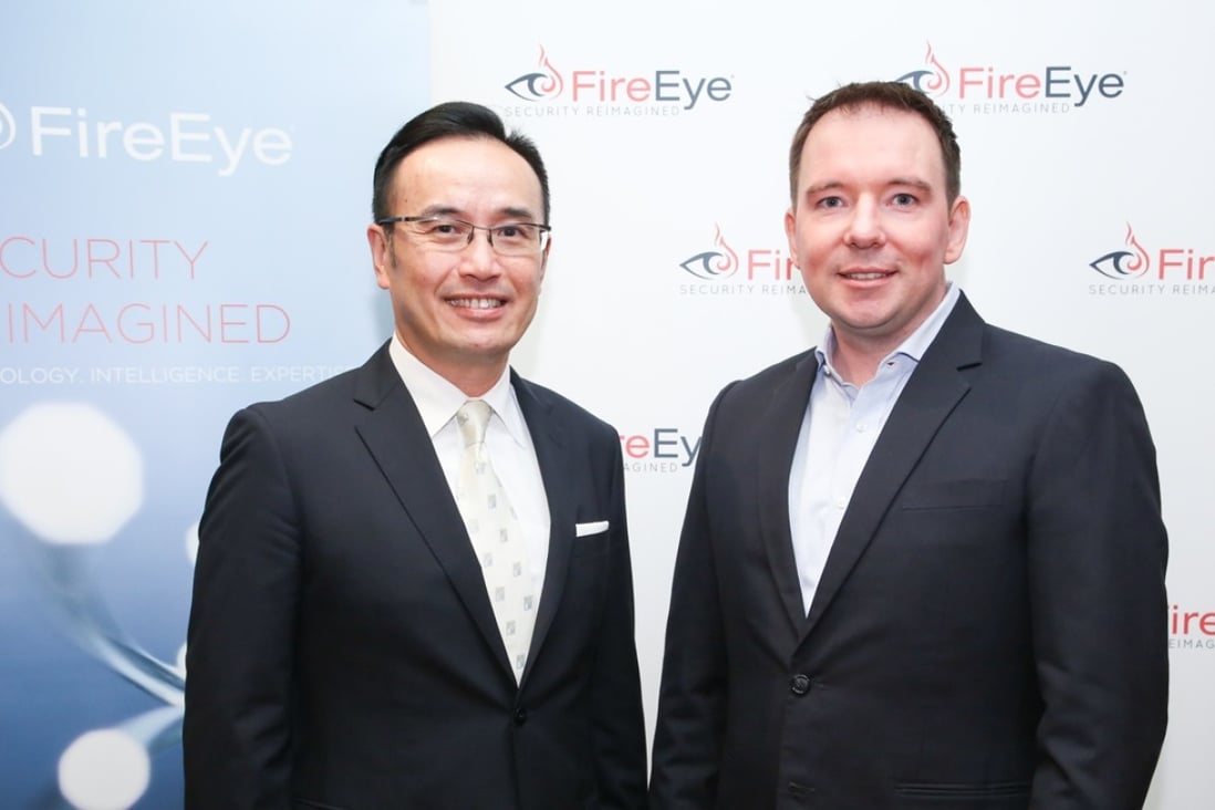 FireEye executives Michael Chue (left) and Bryce Boland warn about hacker attacks originating from the mainland. Photo: SCMP Pictures