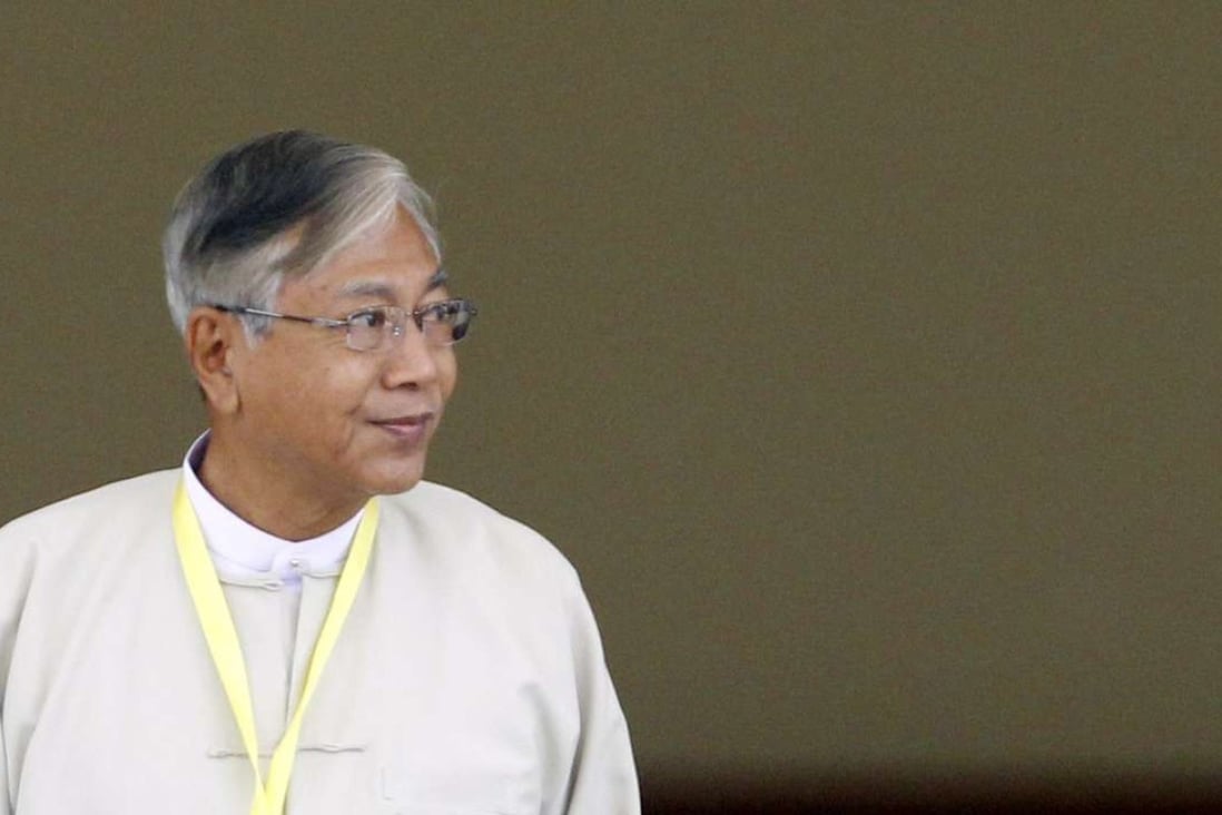 Newly elected president of Myanmar Htin Kyaw leaves parliament after he was voted in. Photo: EPA
