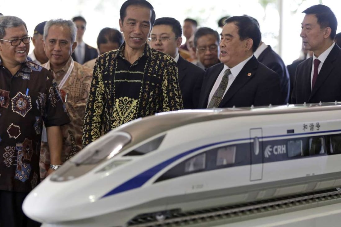 Indonesian President Joko Widodo with Sheng Guangzu, general manager of China Railway, at the groundbreaking ceremony for the Jakarta-Bandung fast-train railway line in Indonesia in January. Construction was suspended days later. Photo: Reuters
