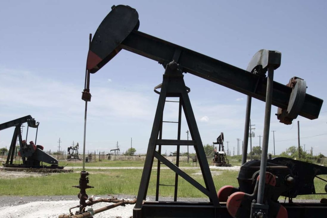 Oil pump jacks work in a field near Houston, Texas. Harris County has added more than 440,000 people since 2010 Photo: AP