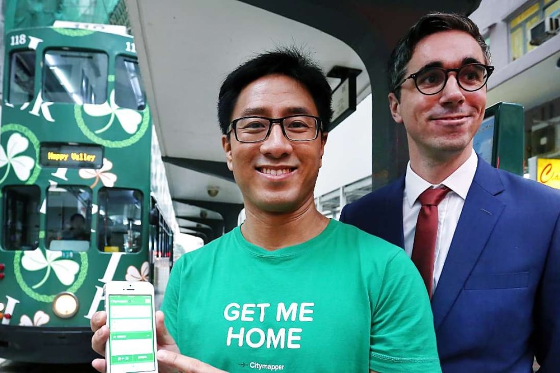 Citymapper’s Gene Soo (left) and Hong Kong Tramways’ Emmanuel Vivant demonstrate real-time tram data on the app. Photo: Jonathan Wong