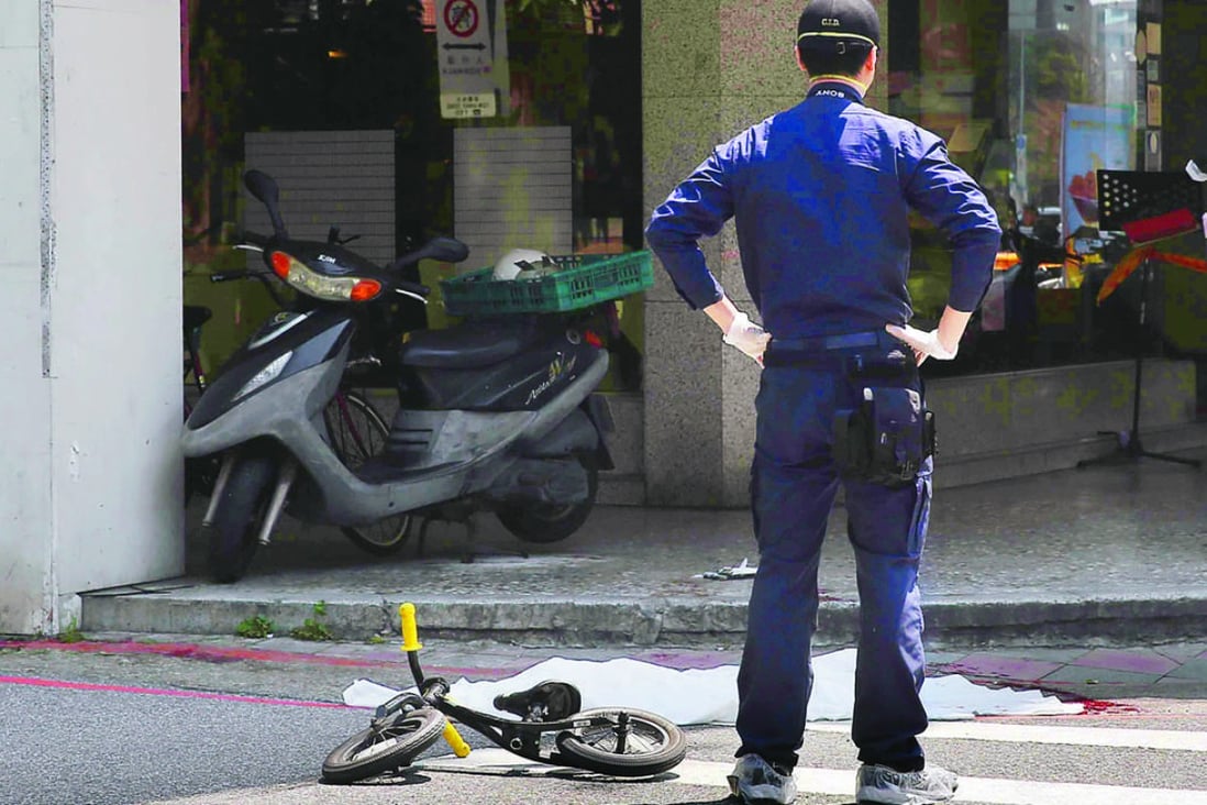 Forensic police officers inspect the crime scene where the 4-year old girl was killed in Taipei’s Neihu district in Taiwan on Monday. Photo: SCMP Pictures