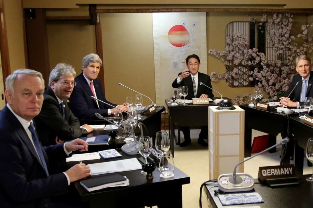 Japanese Foreign Minister Fumio Kishida (second from right) with French Foreign Minister Jean-Marc Ayrault (left), Italian Foreign Minister Paolo Gentiloni (second from left), US Secretary of State John Kerry (third from left) and Canadian Foreign Minister Stephane Dion (right) during their third session of the G7 Foreign Ministers' meeting in Miyajima on Sunday. Photo: AFP