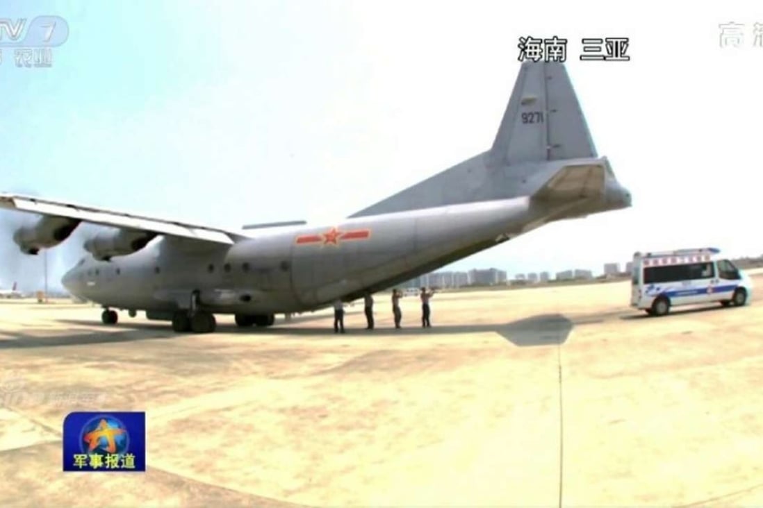 The Chinese military aircraft pictured at the airport at Sanya after transporting three critically ill construction workers from Fiery Cross Reef in the South China Sea. Photo: CCTV