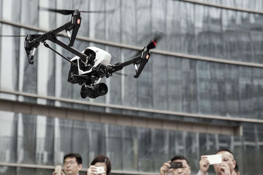 A DJI Inspire 1 Pro drone is flown during a demonstration at DJI Technology headquarters in Shenzhen. Chinese technology companies are now leaders in global M&A activity. Photo: Bloomberg