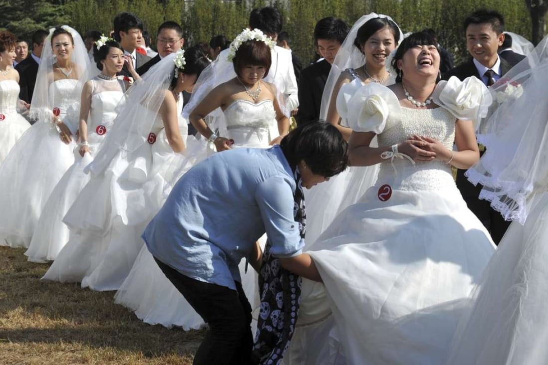 A mass wedding in Beijing. The number of Hong Kong women marrying Chinese men rose more than fivefold between 1991 and 2013. Photo: AFP