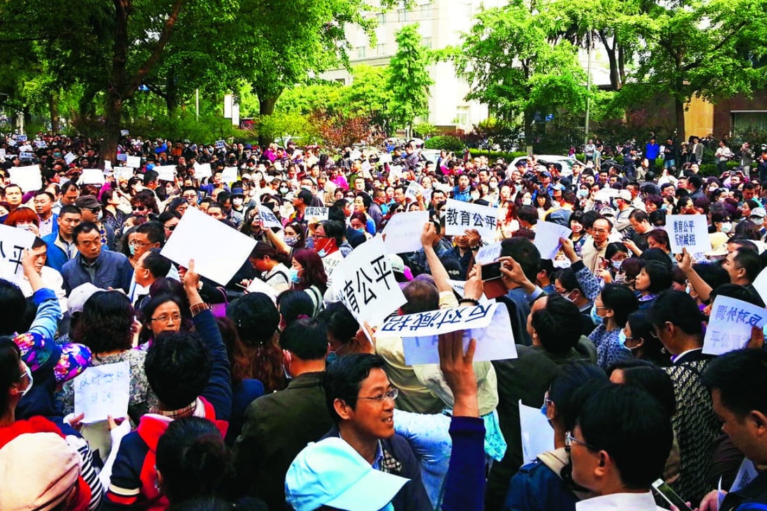 Parents in Nanjing, the capital of Jiangsu province, protest on Saturday against a new policy that allows more non-locals into top universities. Photo: ImagineChina