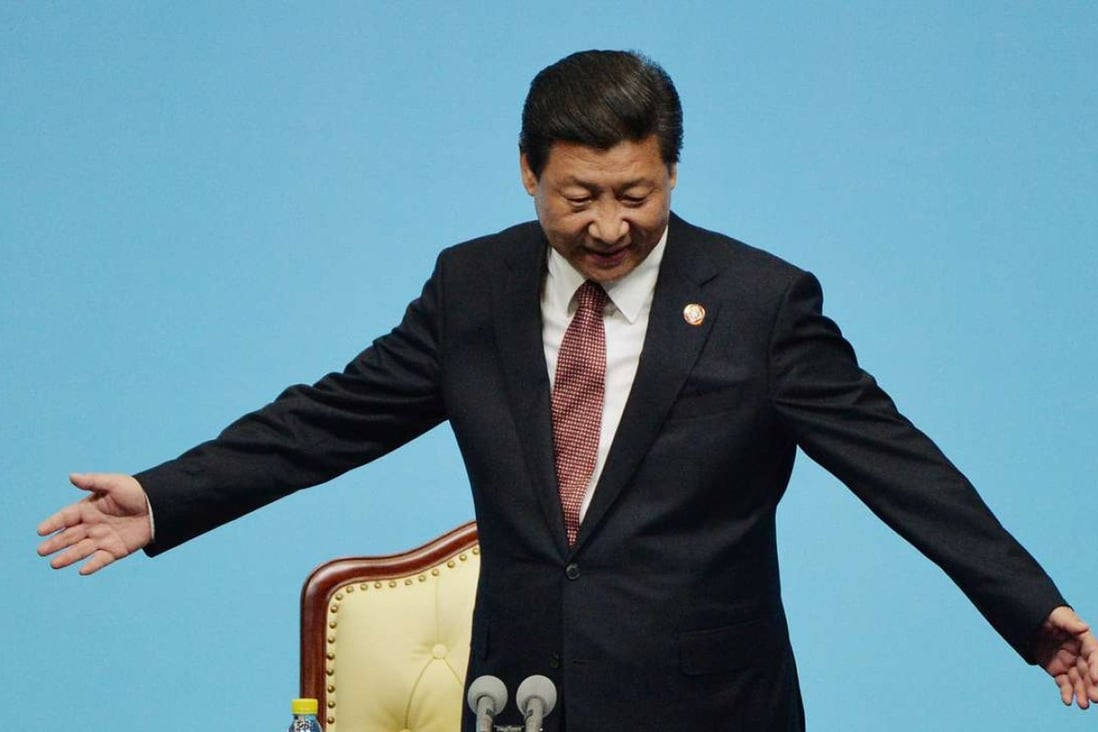 CORRECTION: REMOVE REFERENCES TO POOL Chinese President Xi Jinping gestures at the closing press conference of the fourth Conference on Interaction and Confidence Building Measures in Asia (CICA) summit at the Expo Center in Shanghai on May 21, 2014. AFP PHOTO/ Mark RALSTON