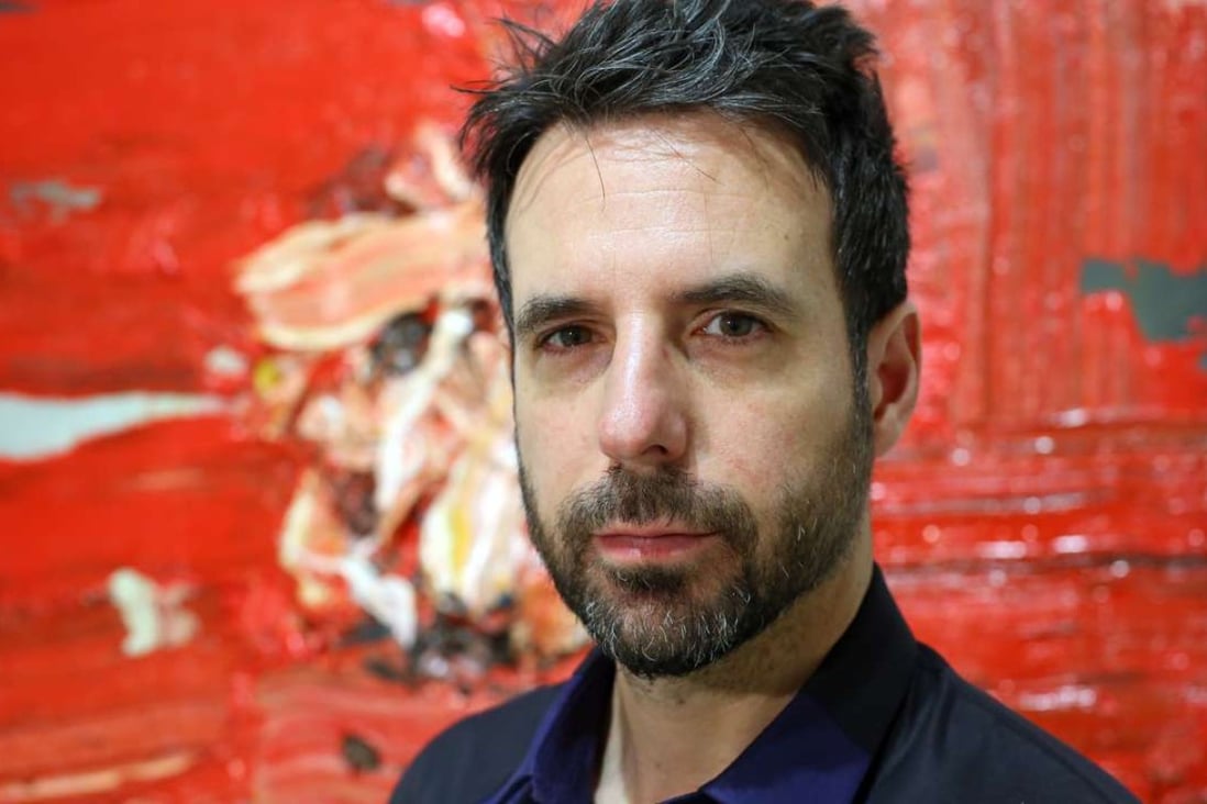British artist Antony Micallef in front of one of his works at Pearl Lam Galleries. Photo: Edmond So