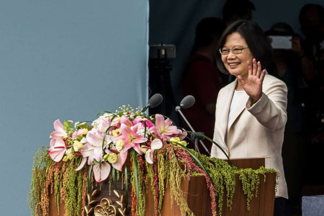 Tsai Ing-wen, Taiwan’s incoming president, waves during her inauguration ceremony at the Presidential Palace in Taipei, Taiwan, on Friday. Tsai said she will seek peaceful ties with Beijing while resisting pressure to acknowledge the idea that they are part of a single nation. Photo: Bloomber