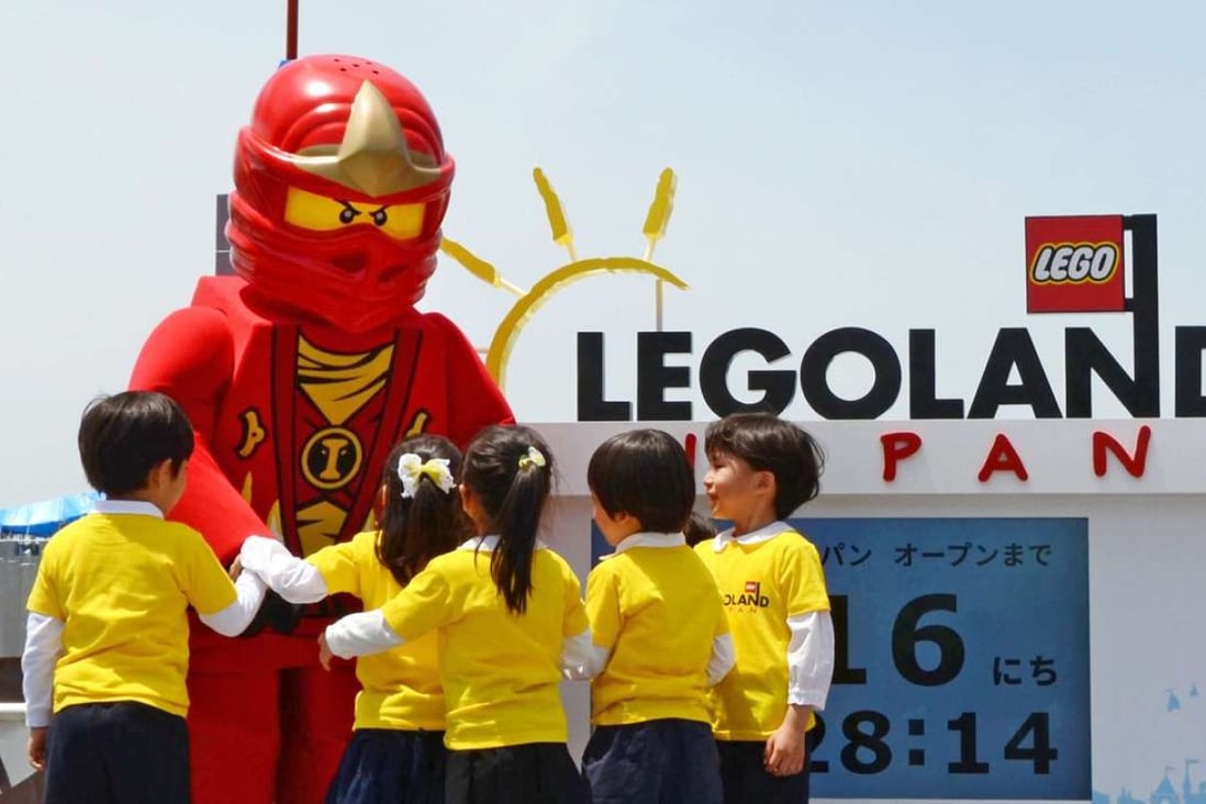Kindergarten pupils play with a Lego mascot during a ceremony in Nagoya on May 19 to announce the opening of Japan's first outdoor Legoland theme park next year. Photo: Kyodo