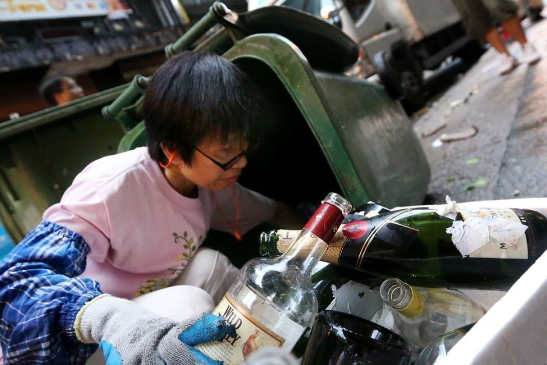 Empty bottles are collected from Hong Kong’s main bar district Lan Kwai Fong in Central. Photo: SCMP Pictures