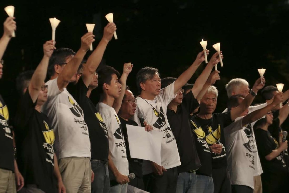Members of the Hong Kong Alliance in Support of Patriotic Democratic Movements of China hold candles at the vigil in Victoria Park in 2015. Photo: Felix Wong