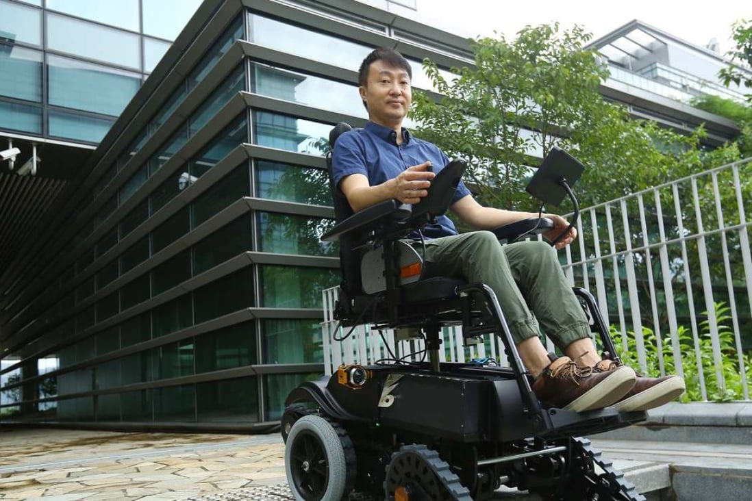 Alan Lee, inventor and director of B-Free Technology, with his stair-climbing wheelchair at Science Park. Photo: Edmond So