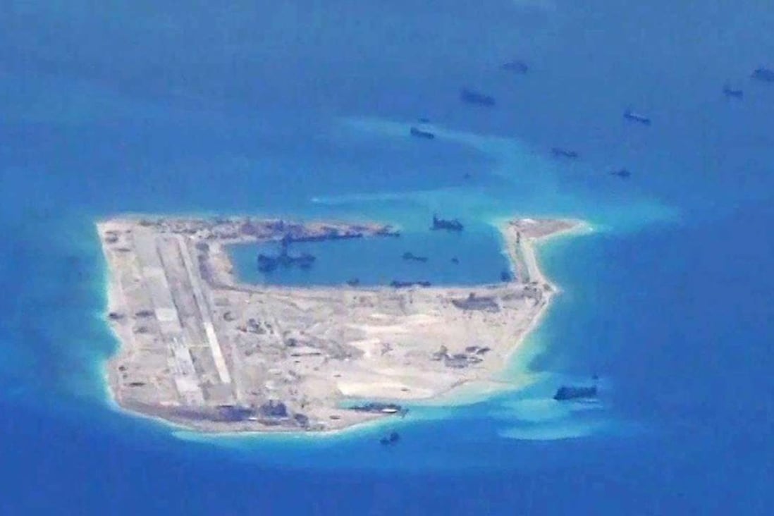 Chinese dredging vessels are purportedly seen in the waters around Fiery Cross Reef in the disputed Spratly Islands in the South China Sea. Photo: Reuters