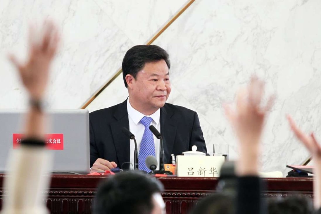 Lu Xinhua speaks to the media at a press conference at the Great Hall of the People in Beijing before the 12th CPPCC in March, 2015. Photo: Simon Song